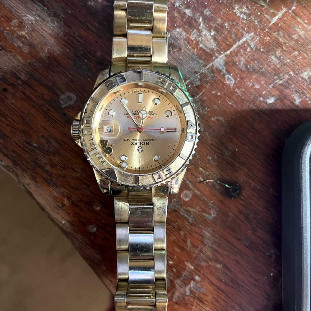 Rolex Gold Watch Timeless not real but still goes for a lot of money